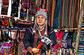 Woman of the Akha tribe poses with her traditionnal haiddress at her village near Chiang Rai, Northern Thailand. 